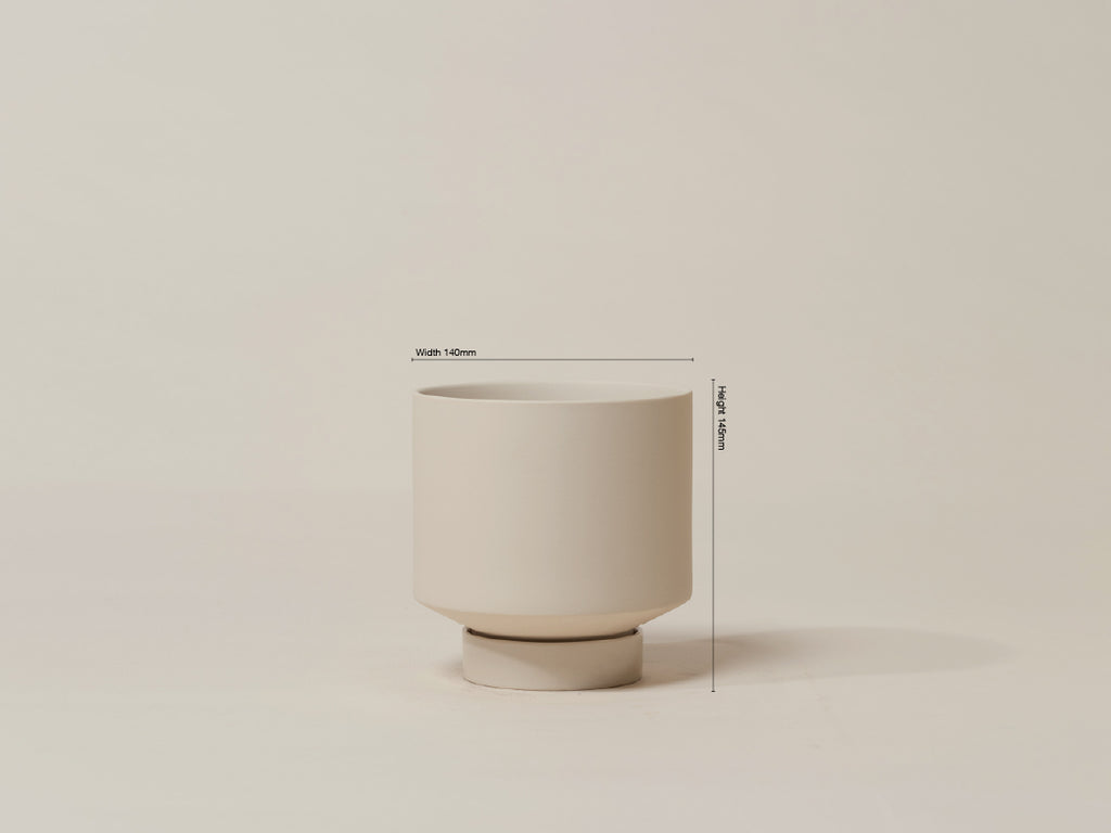 Beige ceramic planter with dimensions on a beige background