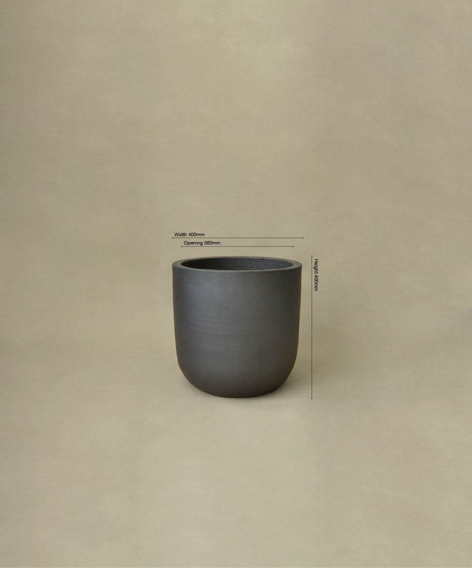Dark gray ceramic cup with dimensions on a beige background