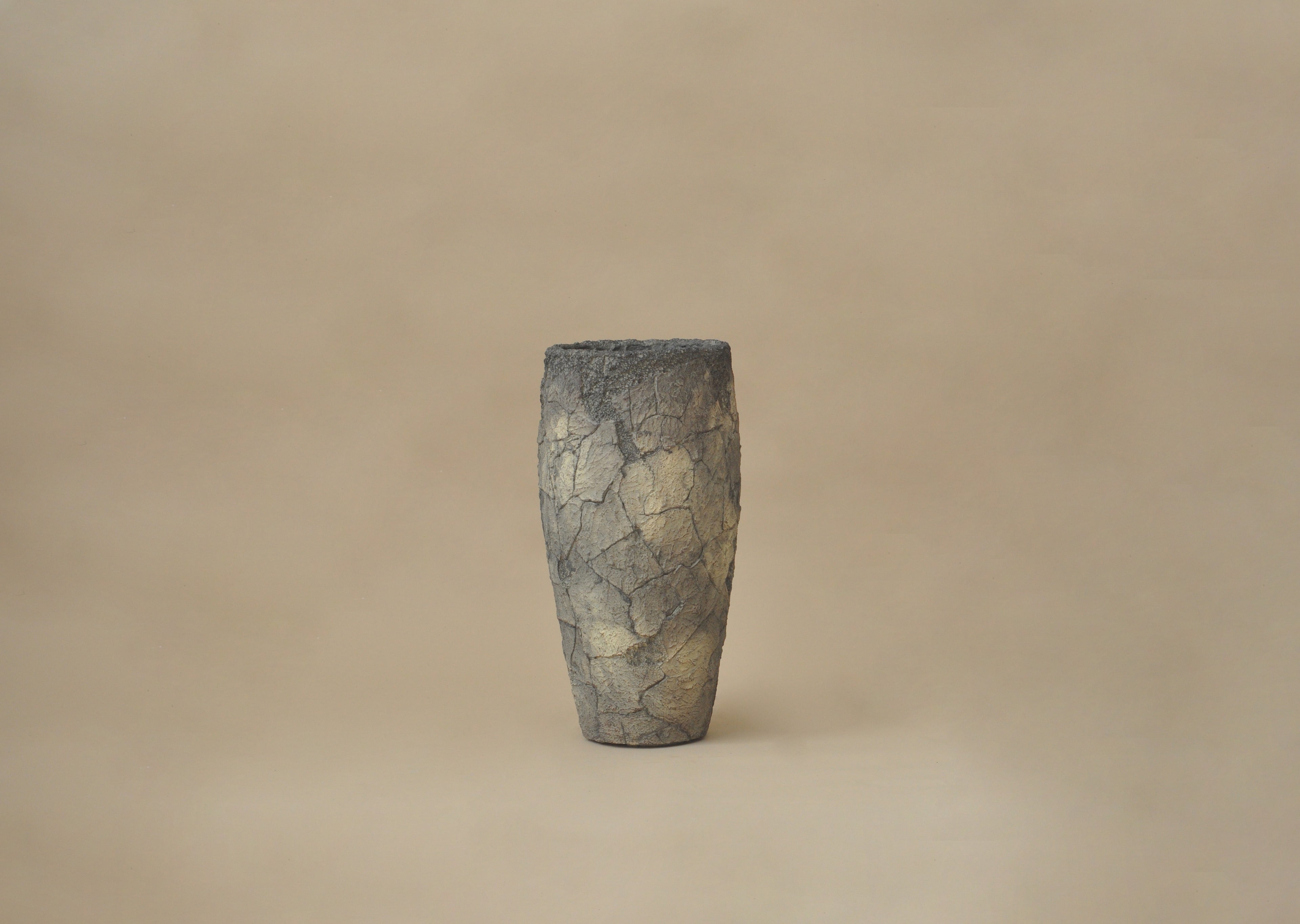 Textured vase on a beige background
